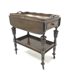 Early 20th century oak tea trolley, carved cup and cover supports joined by solid undertier, W76cm, H81cm, D82cm