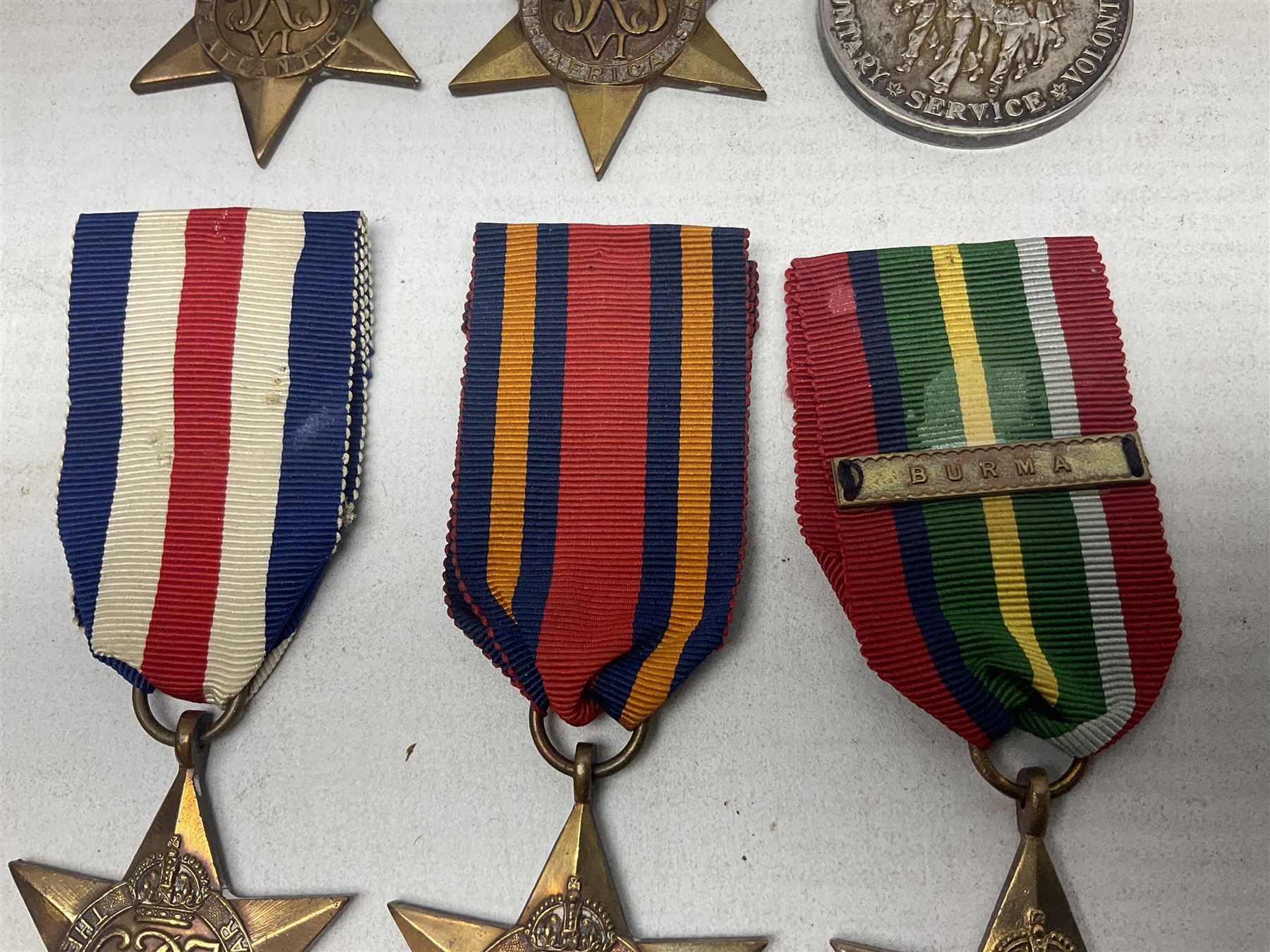 WW2 Canada Volunteer Service Medal 1939-45 with maple leaf clasp; and five WW2 Stars - Burma Star, Atlantic Star, Africa Star with 8th Army clasp, France and Germany Star and Pacific Star with Burma clasp; all with ribbons (6)