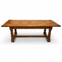 17th century design rustic oak refectory dining table, rectangular plank top over plain frieze rails, raised on heavily turned legs united by an H-stretcher  