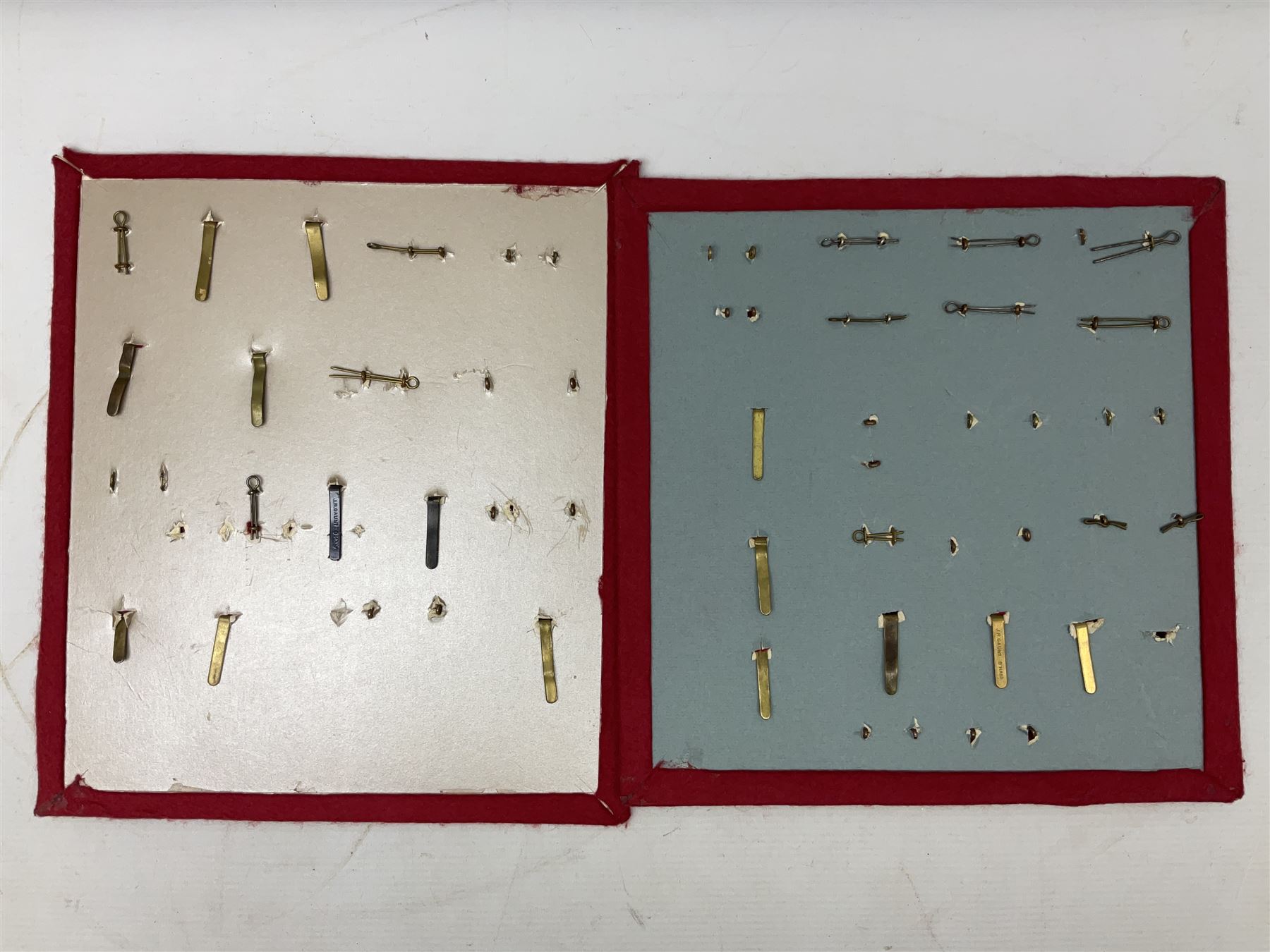 Forty glengarry and cap badges and shoulder titles including Gordon Highlanders, Canada and Canadian Field Artillery, New Zealand Field Artillery and Rifle Regiment, Shropshire Light Infantry, 14th/20th Kings Hussars, 17th Lancers, Northamptonshire Yeomanry, Royal Lincolnshire, Special Air Service, 19th Alexandra P.W.O. Hussars etc; mounted on two boards for display (2)