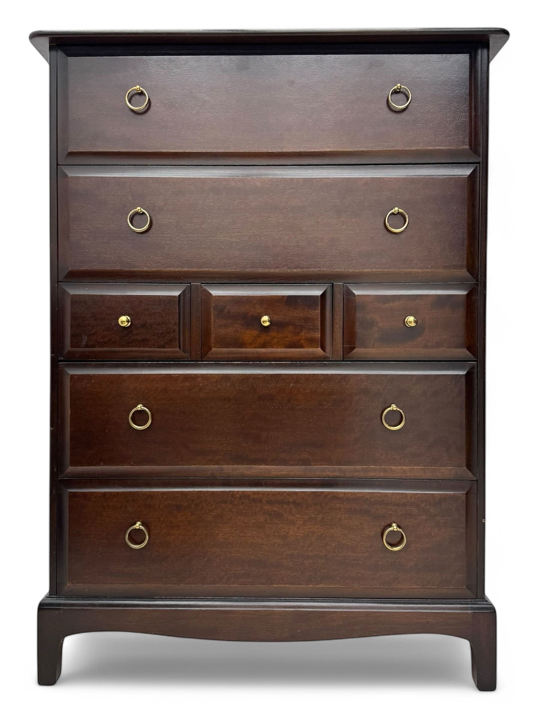 Stag Minstrel - mid-20th century chest, rectangular top over arrangement of three short and four long drawers, on bracket feet