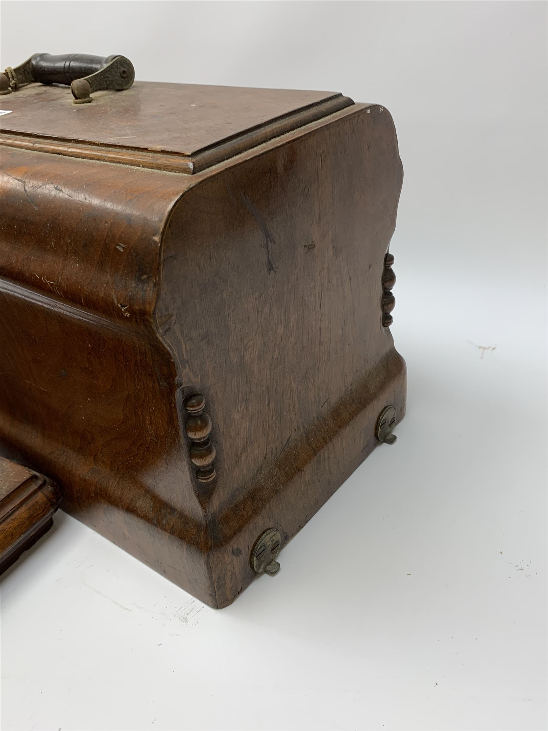 Two vintage sewing machines, the first marked Federation, in mahogany case, the second marked Singer, in oak case. 