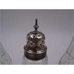 Late 18th century silver cruet stand, of oval form, with pierced sides upon four bun feet, hallmarked to handle Hester Bateman, all other hallmarks indistinct, together with five matched silver mounted cut glass cruet bottles, including some later Victorian examples, hallmarks predominantly indistinct, stand H20cm