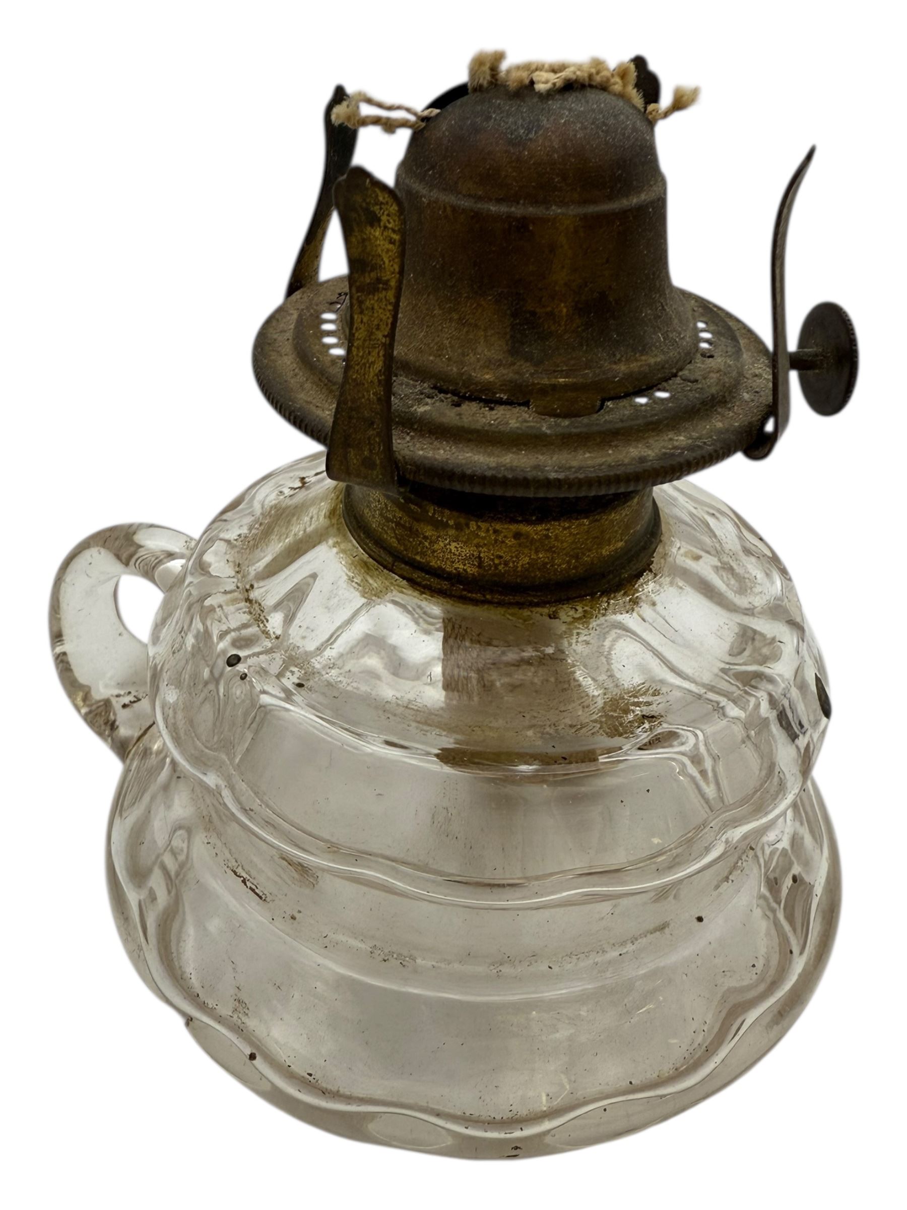 Wells Patent Unbreakable Safety hand held oil lamp, together with a glass hand held oil lamp