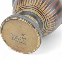 20th century Grecian urn, with twin handles and fluted rim, marked beneath 'Copy 520 BC' handmade in Greece, H31cm