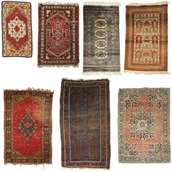 Collection of seven antique to late 20thc Persian rugs of varying sizes and designs: Afgha...