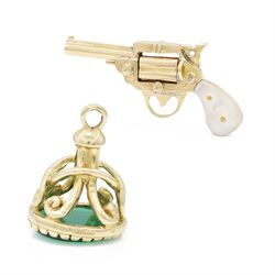 Two gold pendants / charms including 16ct gold revolver with articulated barrel and mother...
