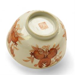 Chinese tea bowl, the enamel decoration depicting floral sprigs within a gilt and blue boarder, with a crowned shield to the centre, together with another bowl and a saucer