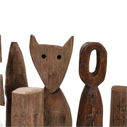 Hand carved folk art figures, including totems, mushroom and cat, largest H34cm