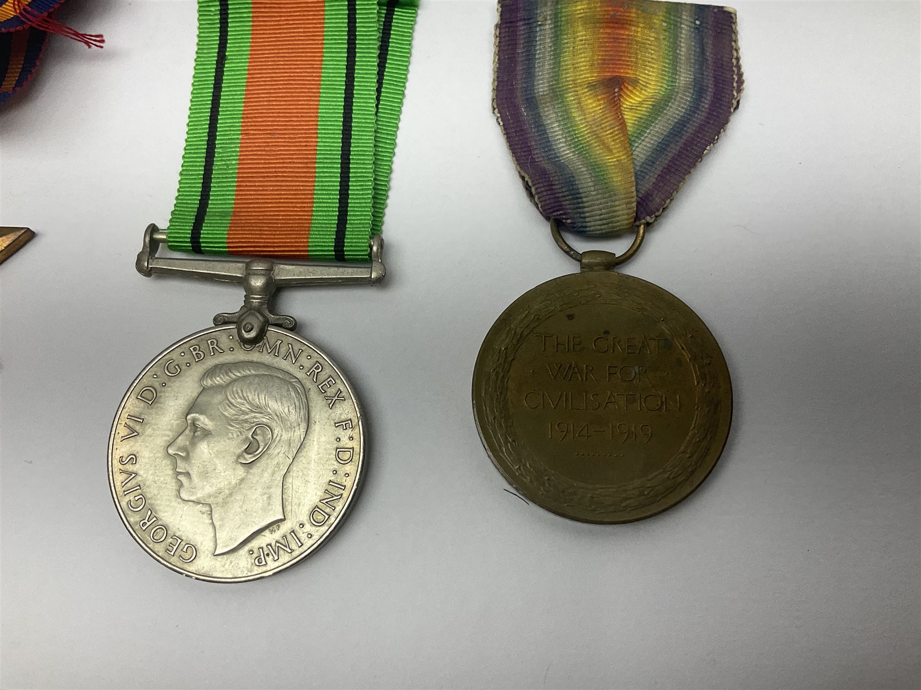 WW1 pair of medals comprising British war medal and Victory Medal awarded to 19774 Pte. G. Headlam Sea. Highrs.; another WW1 pair of medals comprising British War Medal and Mercantile Marine Medal awarded to Charles Filburn; WW2 group of five medals comprising 1939-45 War Medal, Defence Medal, 1939-45 Star, Africa Star and Burma Star; in issue box addressed to Mr. H, Smithson with medal slip; all with ribbons; and Edward VIII Coronation medal (10)