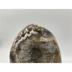 Agate crystal geode cluster, in brown and purple tones, upon a metal stand, H26cm
