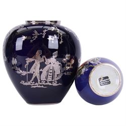 Heinrich vase with silver overlay depicting figures in period dress upon a cobalt blue ground, together with German vase with floral decoration and silver overlay, largest H21cm 