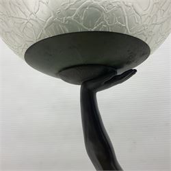 1930s Art Deco spelter table lamp, modelled as a nude woman holding aloft a spherical crizzled glass shade, upon a marble base, H48cm
