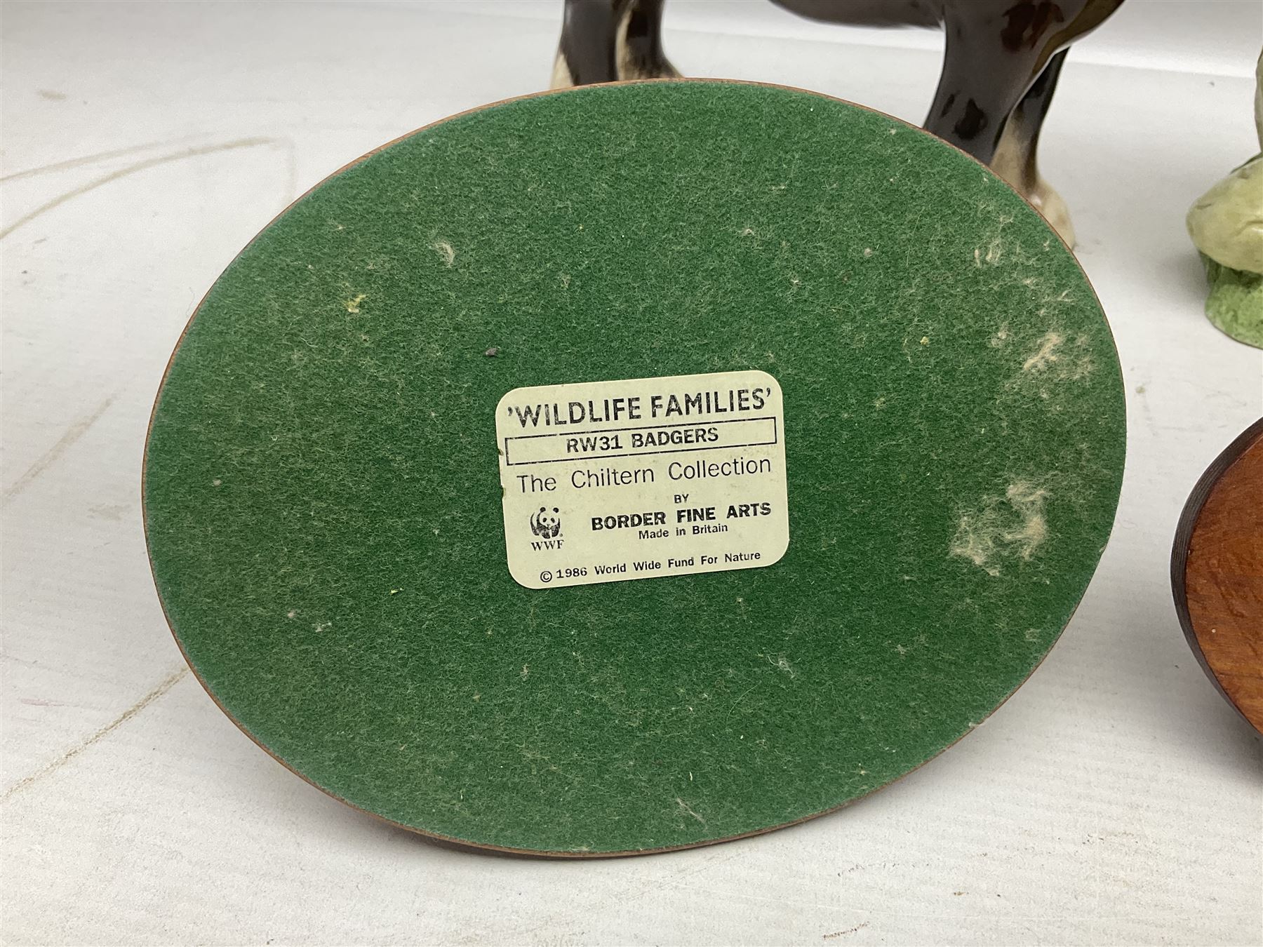 Two Border Fine Arts figures, comprising Badgers and Blackbird, together with Beswick bay shire horse no 818 and another figure