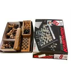 Collection of wooden chess pieces, together with two boards and a MK12 trainer Kasparov training programme 
