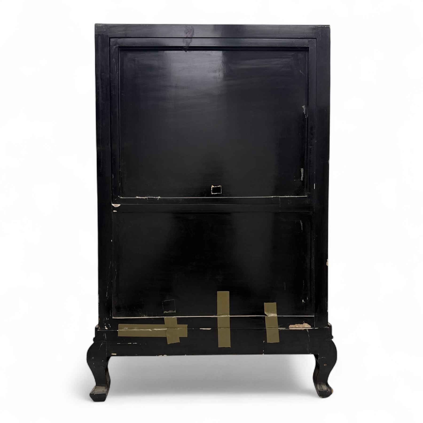 Late 20th century Chinoiserie black lacquer cabinet, the rectangular body decorated with hand-painted floral and foliate motifs in polychrome and gilt, fitted with four panel doors enclosing shelved interior, on shaped apron and stylised cabriole supports with gilt scrollwork