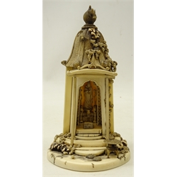  Japanese Meiji period carved ivory shrine temple, the textured sloping roof having intricately carved cherry blossom, leaves and birds, the interior with a figure of Guanyin stood on a carved lotus base, with altar table, censers etc within a pierced archway on a circular stepped base, H17.5cm   