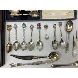 Group of silver plated and other teaspoons, to include a number of souvenir spoons, together with a wall mounted display cabinet, etc. 