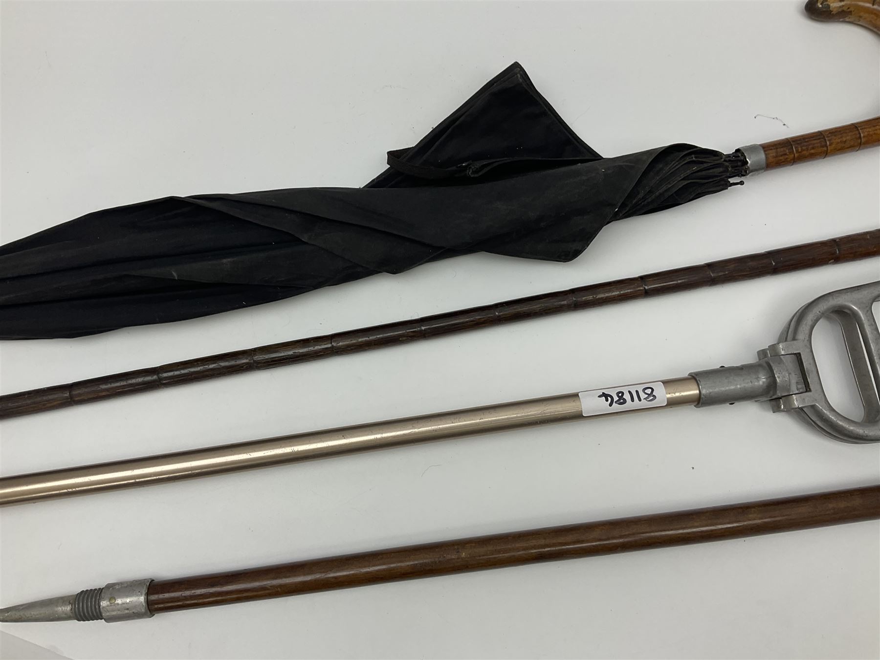 Early 20th century curved horn handle walking stick with hallmarked silver mounts, engraved L Russell 1918, together with a shooting stick by William Mills Birmingham, with leather handle, 'The Featherwaite' shooting stick and an umbrella with wooden handle