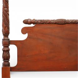 Early 19th century Regency carved mahogany four poster double bed, 4'6, the shaped headboard and footboard each surmounted by a finely carved pinecone and foliate moulded rail, flanked by ring turned and boldly spiral carved tapering posts with acorn finials, raised on square section legs, with slatted base