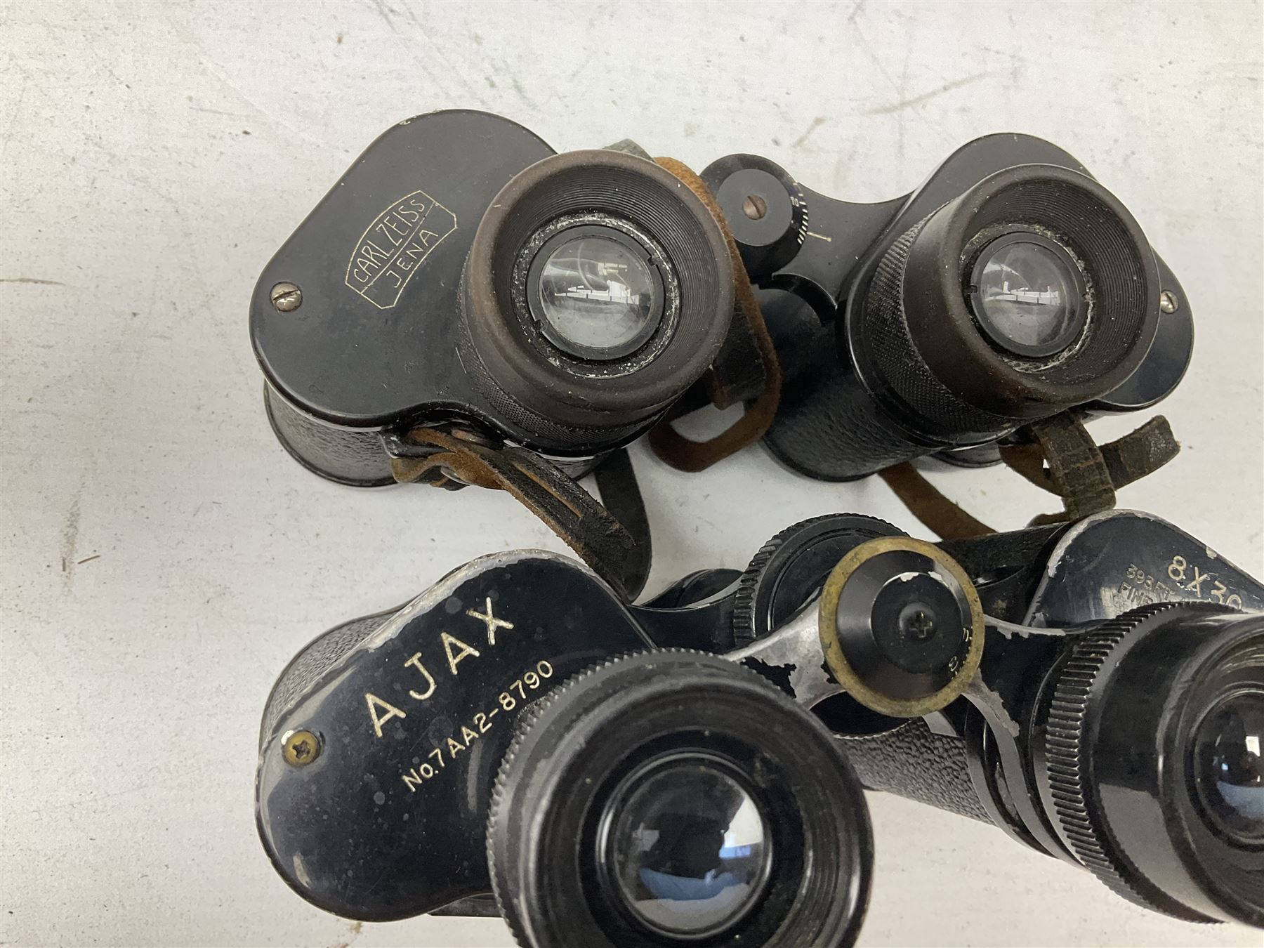 Twelve pairs of binoculars to include BWCF 7x35 Extra Wide Angle, Carl Zeiss Jena Delturis 8x24, Carl Zeiss Jena Jenoptem 8x30W, Chinon Countryman 10x50,  Ajax 8x30, Regent 16x50, etc,  some with cases