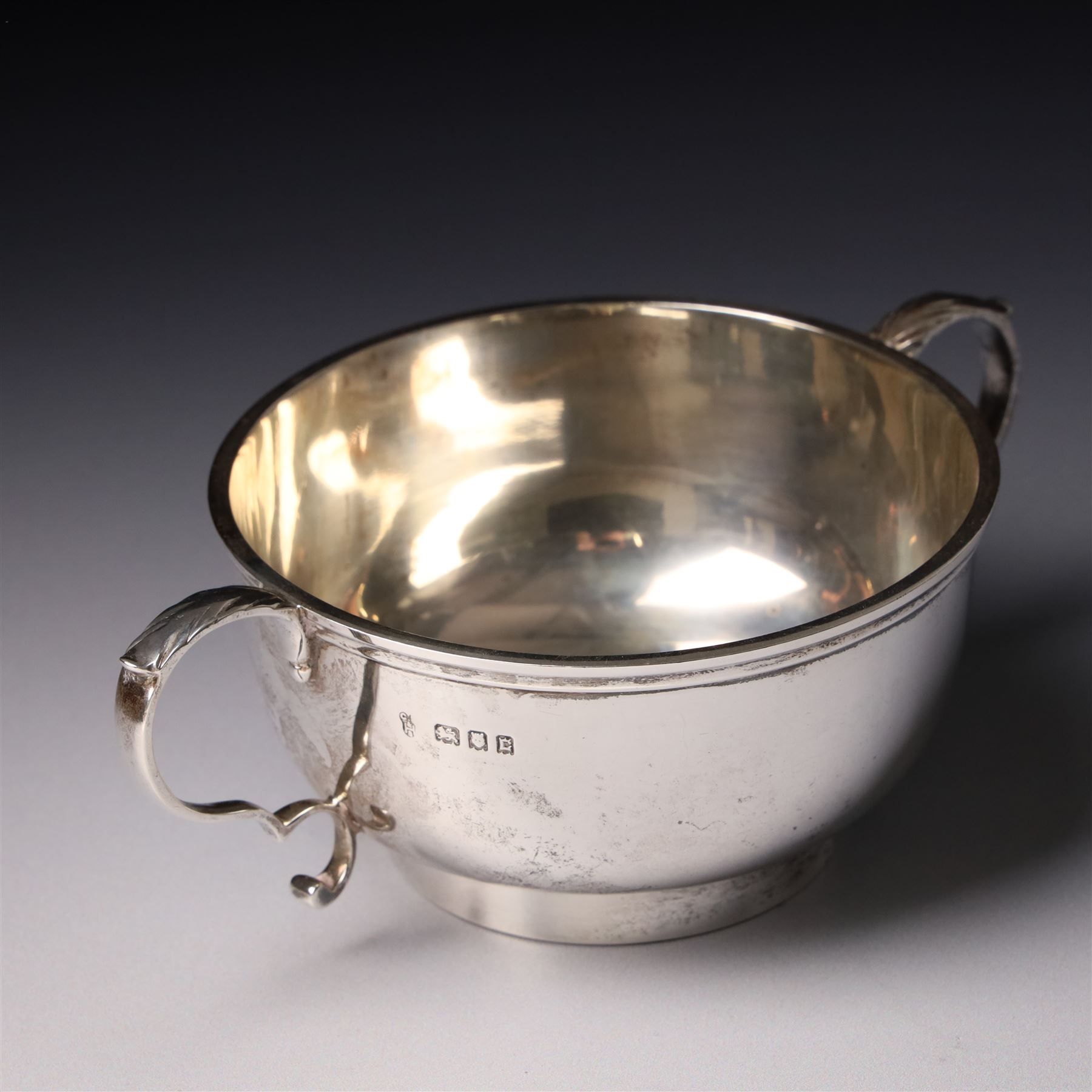 Four piece silver tea and coffee service of baluster form, the tea and coffee pots with domed covers and stained handles London 1916-1918, Maker  C S Harris & Sons Ltd