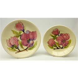  Moorcroft Magnolia pattern plate, D26cm and side plate, D22cm, both with impressed marks (2)  