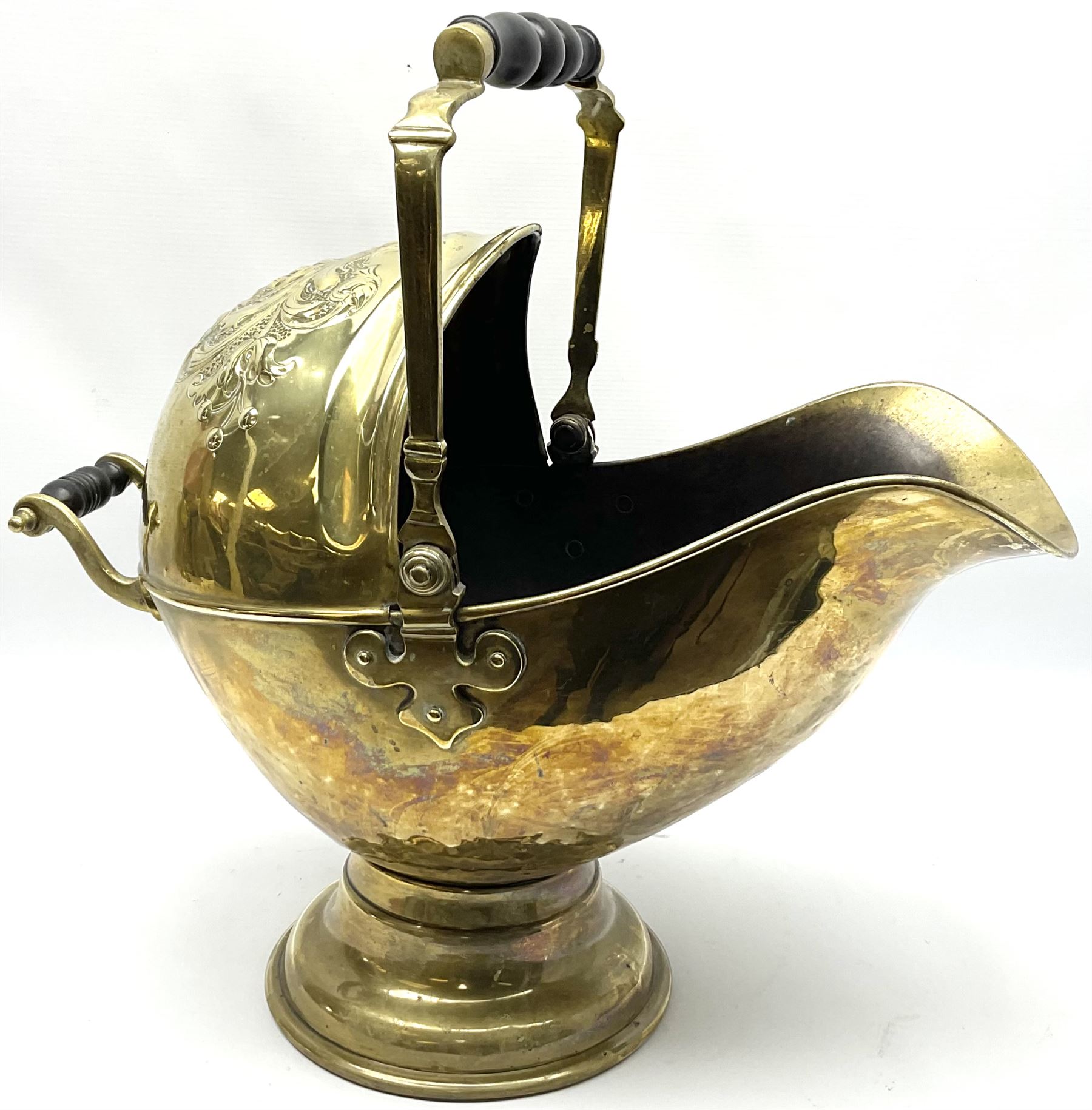 Victorian brass coal scuttle, of helmet form with turned ebonised handles, H48cm