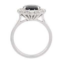 18ct white gold oval cut sapphire and round brilliant cut diamond cluster ring, stamped 750, sapphire approx 3.85 carat, total diamond weight approx 0.80 carat