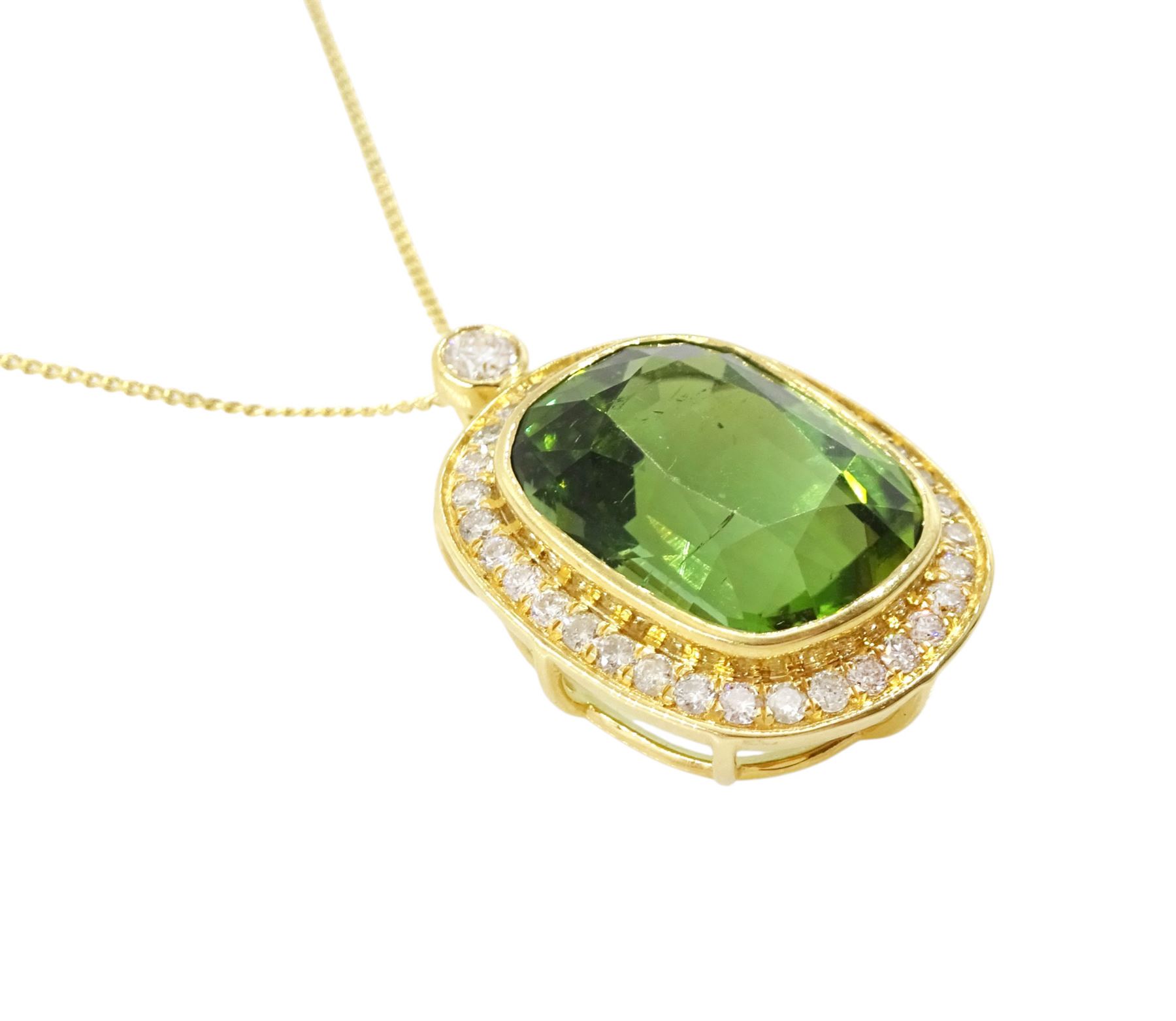 18ct gold green tourmaline and diamond pendant necklace, rectangular cushion cut tourmaline of approx 9.50 carat, surrounded by thirty-four round brilliant cut diamonds and a single stone diamond set bail, on a trace link chain necklace