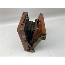 Thornton Pickard Imperial Triple folding plate camera in mahogany and lacquered brass, field model, three mahogany photographic plates and a wooden tripod