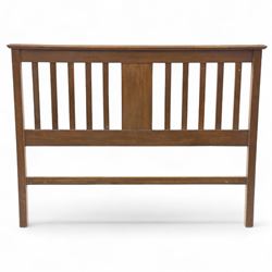 Art Nouveau oak double bed headboard, rectangular form with vertical slats centred by a carved stylised floral roundel