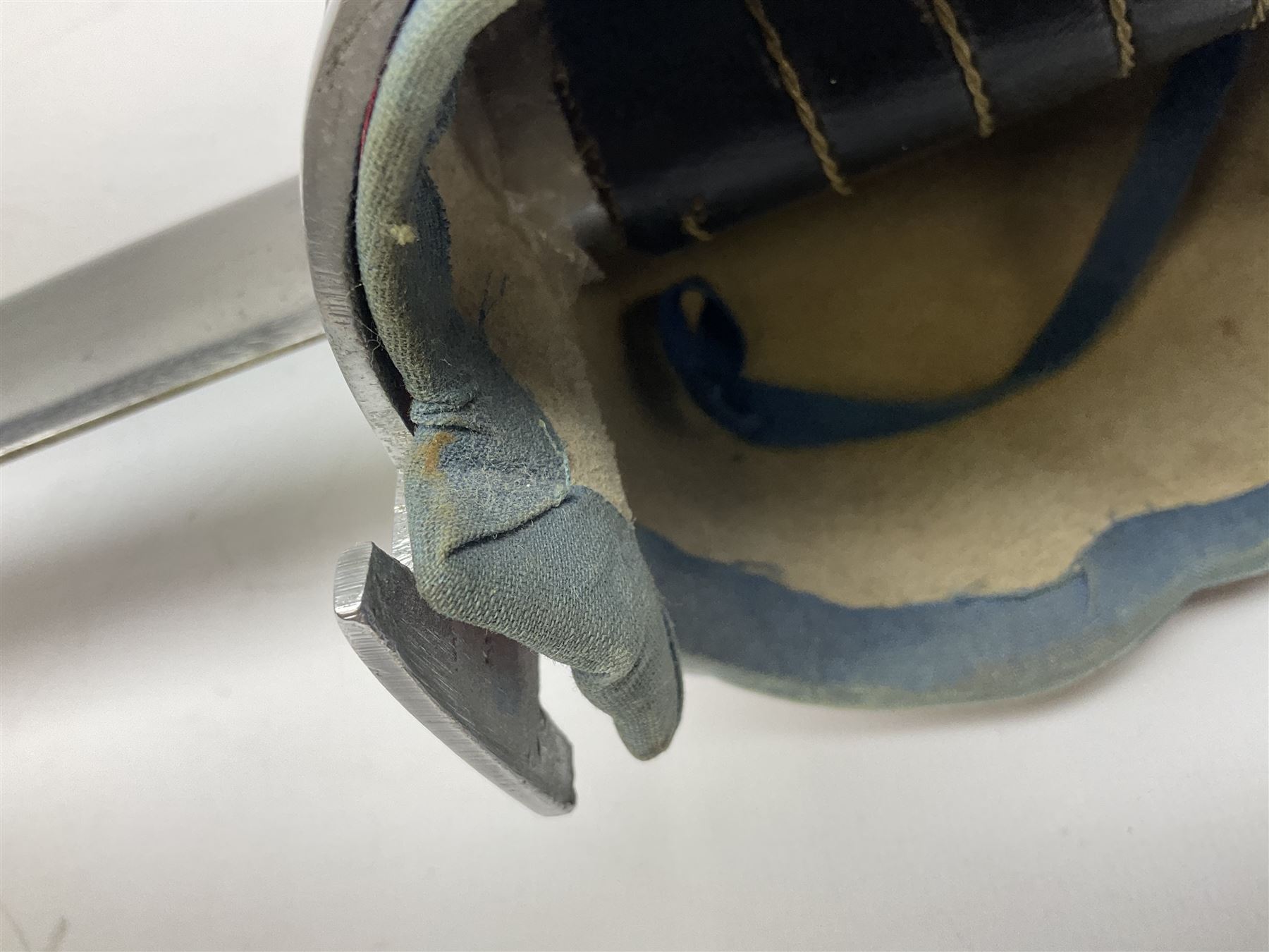 Reproduction Scottish basket hilted broadsword with 85cm double edged steel blade and red lined basket hilt with wire bound grip, in white metal mounted leather scabbard 107cm overall