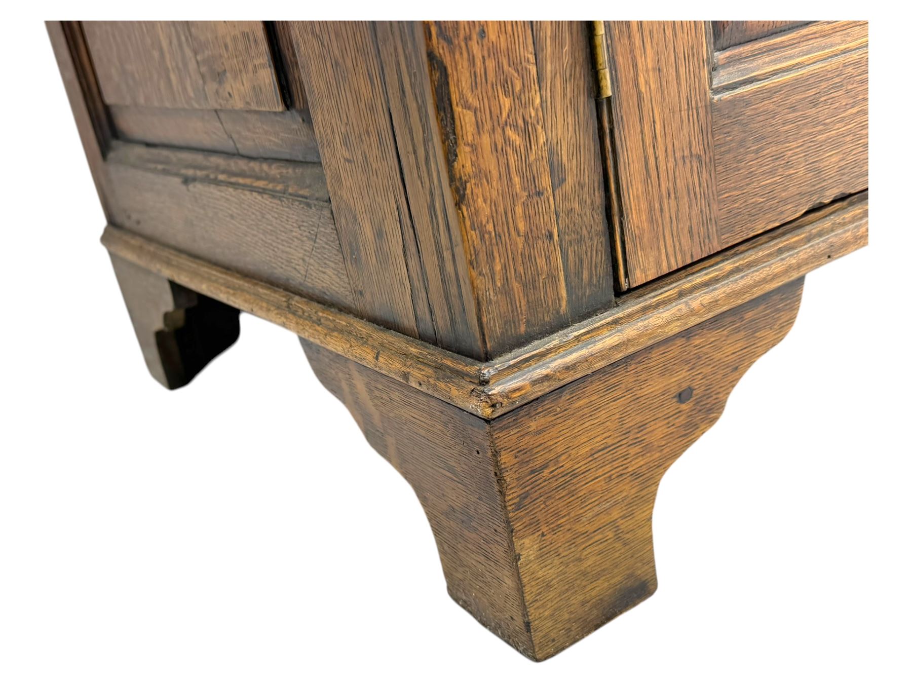 19th century and later oak dresser, moulding cornice a pierced and shaped frieze, over two open plate shelves above a base fitted with two drawers with brass swan neck handles, over panelled twin cupboard with single shelf, cantered corners on bracket feet