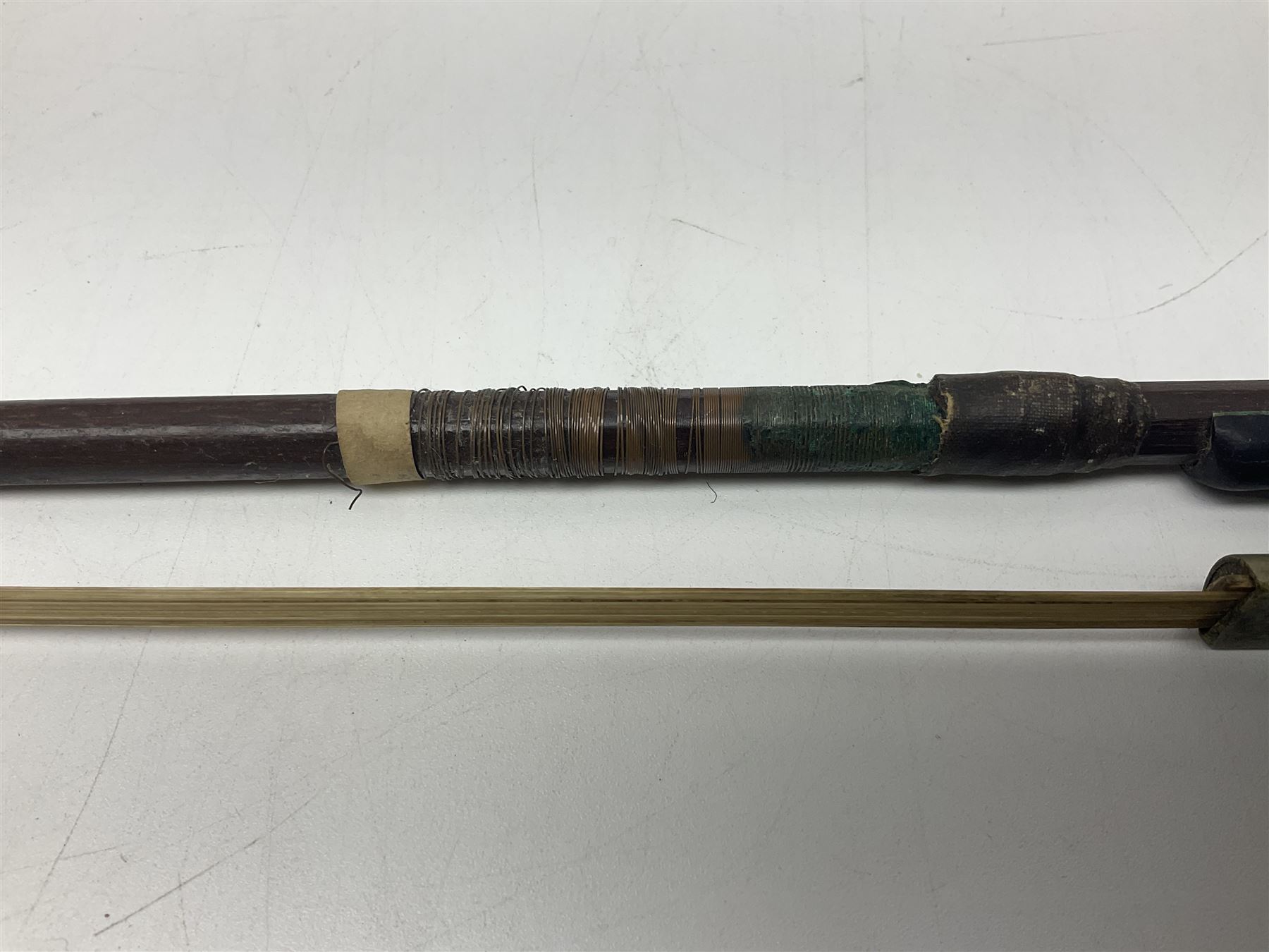 Fruitwood and elm single string phono fiddle with long neck and copper horn L76cm; and a violin bow (2)