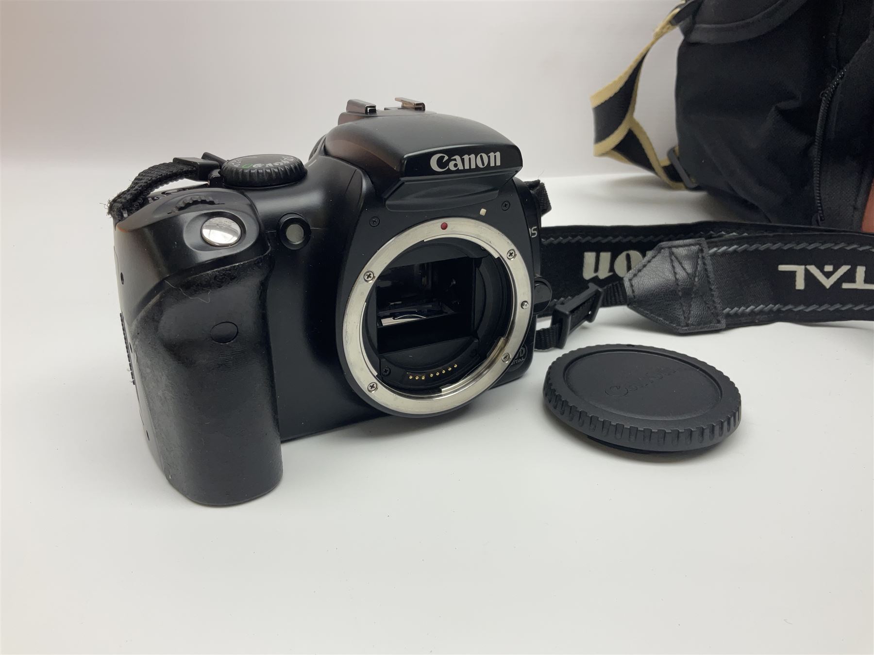 Four camera bodies, to include, Ricoh KR-10 serial no. 38826, Pentax MZ-M serial no. 4185969 with 'SMC Pentax- M 1:3.5 28mm' lens, Canon EOS500 serial no. 080927, with 'Sigma Zoom 100-300mm 1:4.5-6.7 DL'  lens etc, with other camera lenses and equipment 