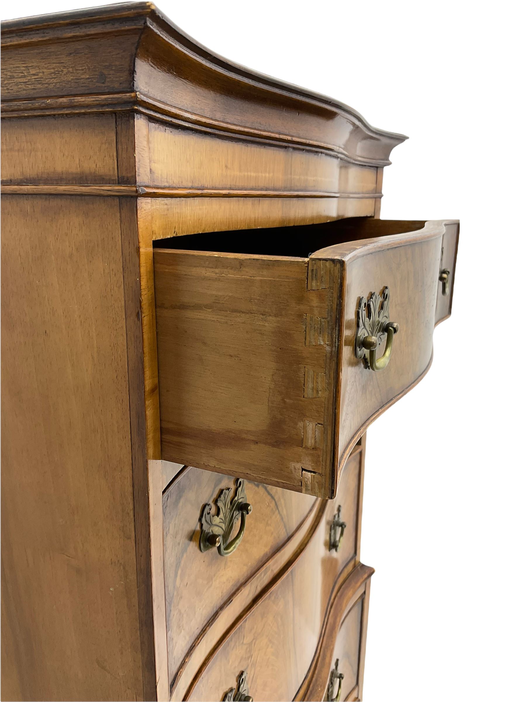 Burton Reproductions walnut chest on chest, fitted with six serpentine drawers