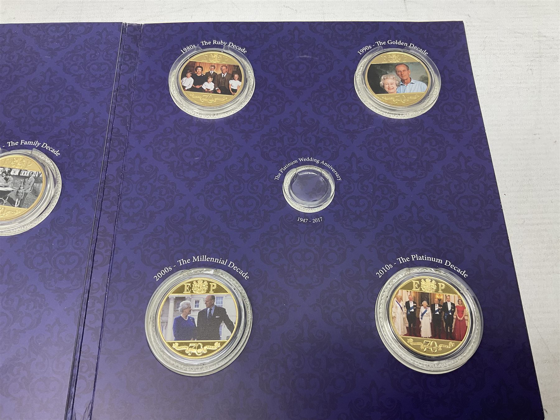 The Royal Mint United Kingdom 2006 brilliant uncirculated coin collection, in card folder and a part set of The London Mint Office 'The Platinum Wedding Anniversary Photographic Collection' coins