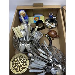 Assorted collectables, to include small quantity of glassware, pair of brass candlesticks, part dressing table set, selection of silver plated flatware, etc., in two boxes 