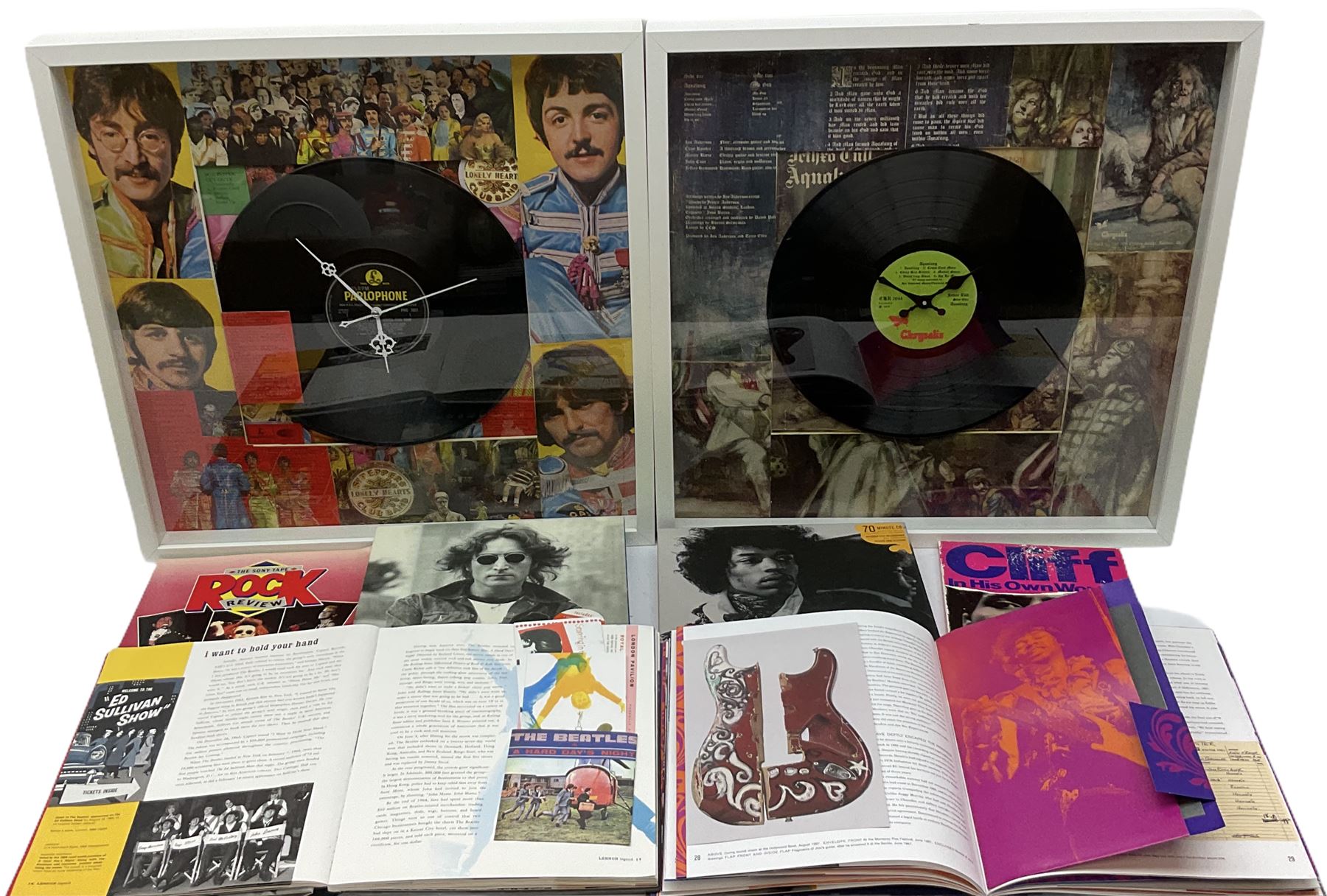 Two novelty framed LP wall clocks; two books containing replica memorabilia and CDs on John Lennon and Jimi Hendrix; Rock Review booklet; and book on Cliff Richard entitled 'Cliff In His Own Words' (6)