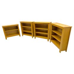 Five light wood open bookcases, four with two adjustable shelves, (W89cm, D29cm, H94cm), one with one adjustable shelf (W89cm, D29cm, H77cm)  
