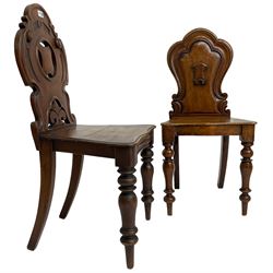19th century mahogany hall chair, pierced and carved shaped back decorated with C-scrolls, solid seat raised on turned supports (W46cm H88cm); together with another similar (W41cm H87cm)