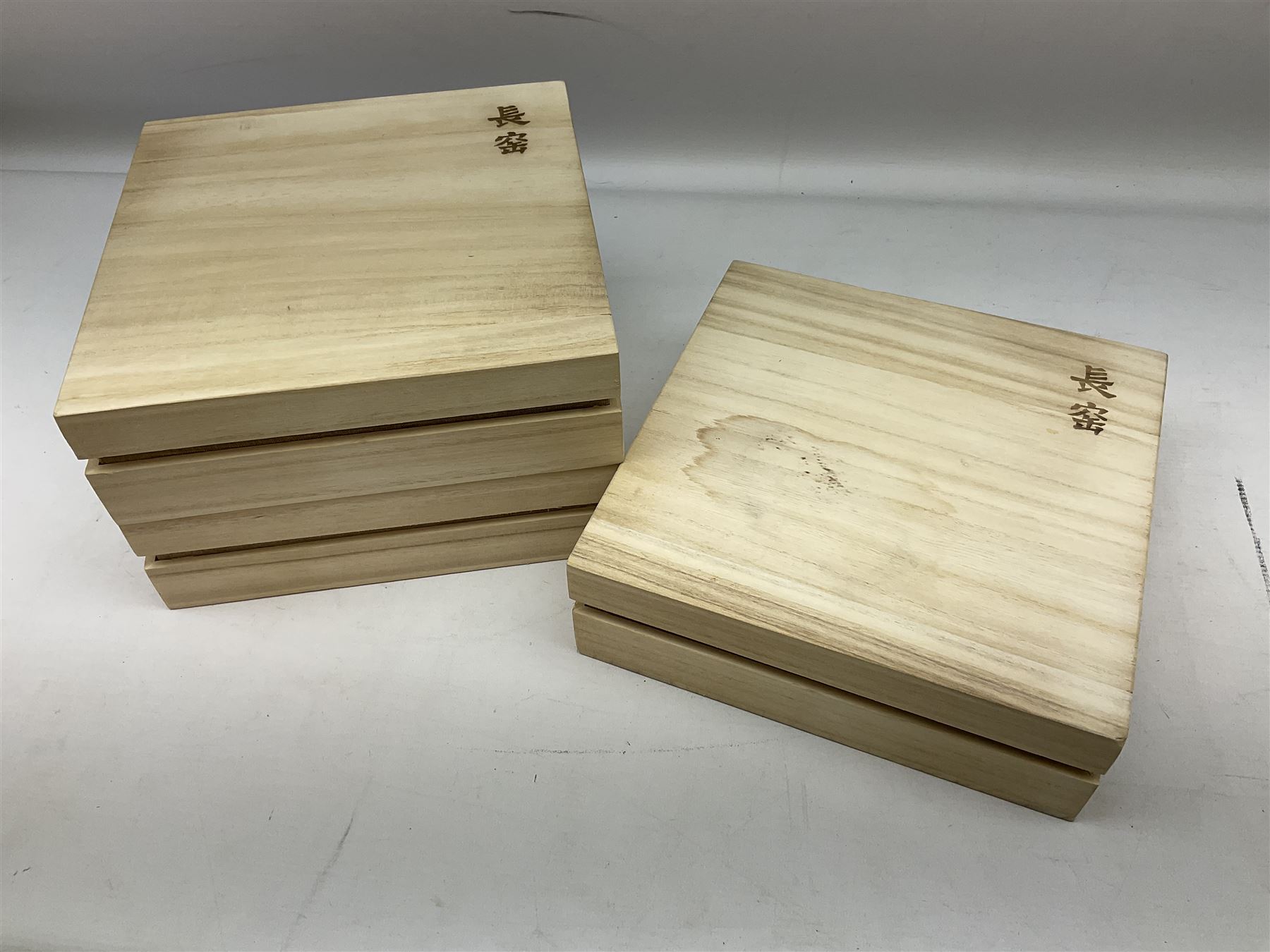 Three Chinese polychrome enamel plates each decorated with floral decoration, all marked beneath, D21cm 