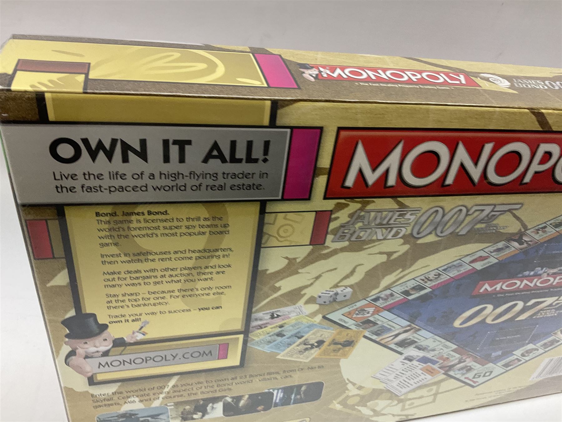 Limited edition framed James Bond 007 Skyfall print, 126/600, boxed Spectre pen, Aston Martin DB5 keyring and sealed 007 50th Anniversary Edition boxed monopoly game (4)