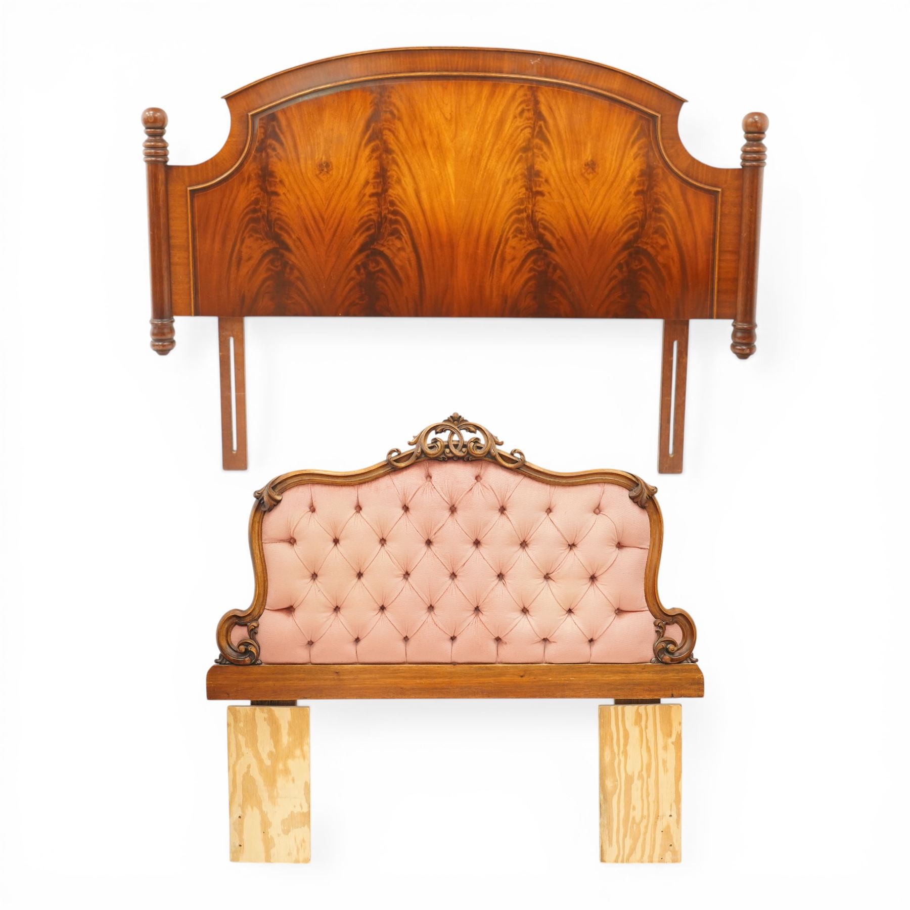 Two 20th century headboards, one with scrolled rail above a pink button backed board (H c127m, W 137cm) the second with flamed mahogany veneer (H 117cm, W 163cm)