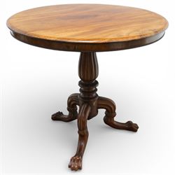 19th century mahogany centre table, with circular tilt top on a turned and reeded column, raised on three carved cabriole legs terminating in paw feet