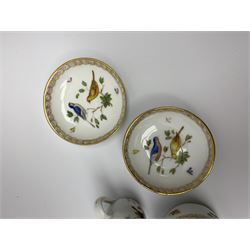 Early 20th century Meissen cabinet miniatures, comprising two teacups and two saucers, jug, and pot and cover, decorated with birds and insects and heightened with gilt, with blue crossed sword marks beneath, tea cup H3cm, saucer D6.5cm