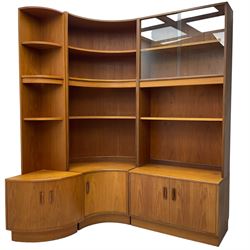 G-Plan - teak three sectional wall unit, fitted with display cabinet enclosed by two sliding glass doors, shelves and cupboards