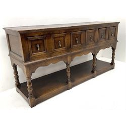 18th century style oak dresser base, three drawers above baluster turned supports on a pot board base