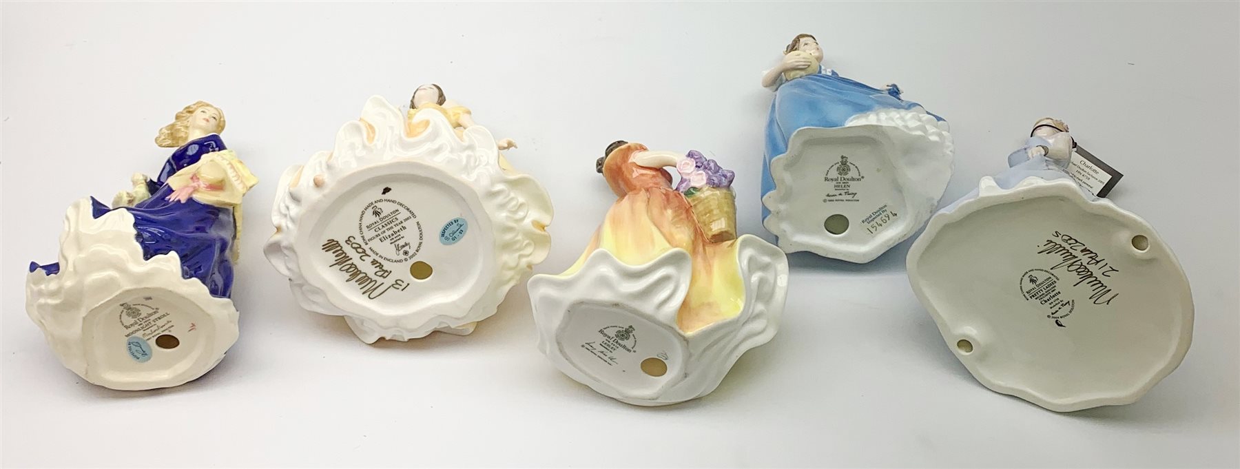 A group of five boxes Royal Doulton figurines, comprising Lesley HN2410, Helen HN3601, Moonlight Stroll HN3954, Classics Figure of the Year 2003 Elizabeth HN4426, Pretty Ladies Charlotte HN4758, with accompanying certificate. (5). 